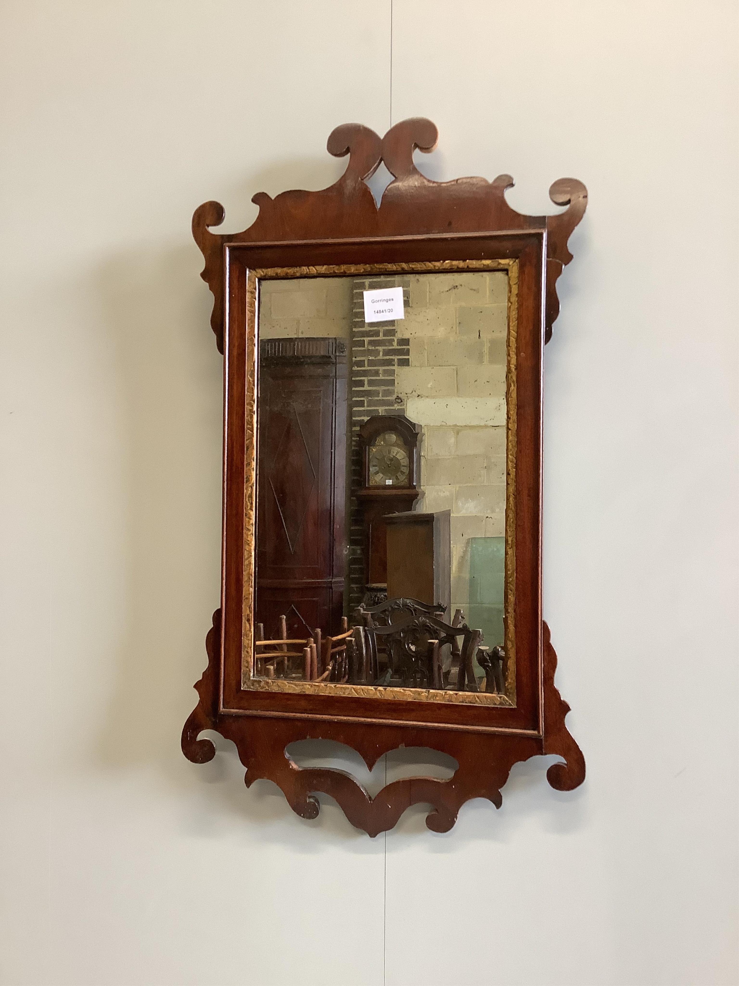 A 19th century mahogany and parcel gilt fret cut wall mirror, width 41cm, height 73cm. Condition - fair